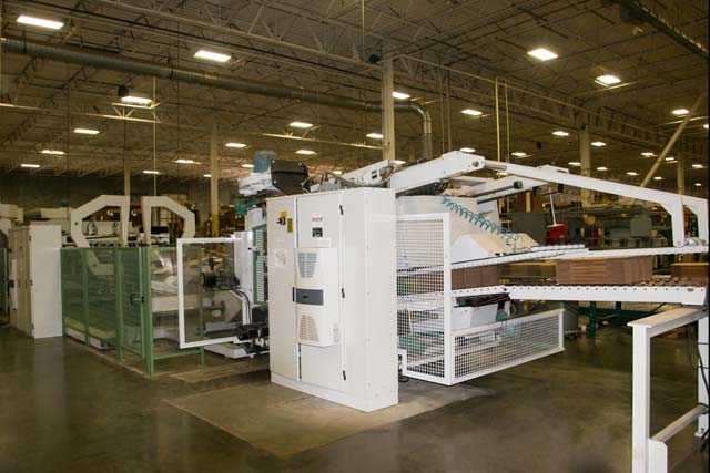 Flexo folder gluer machine in warehouse facility