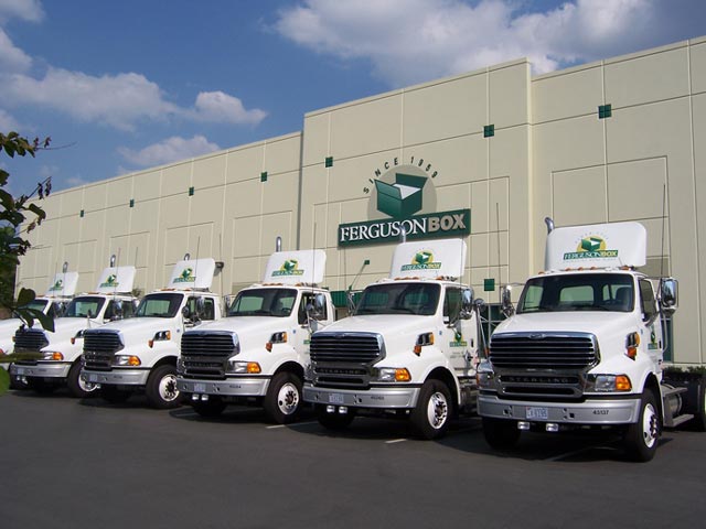 Ferguson Box truck fleet in front of facility